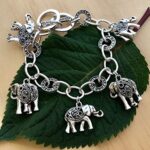 PammyJ Silvertone Filigree Design Elephant Charm Bracelet